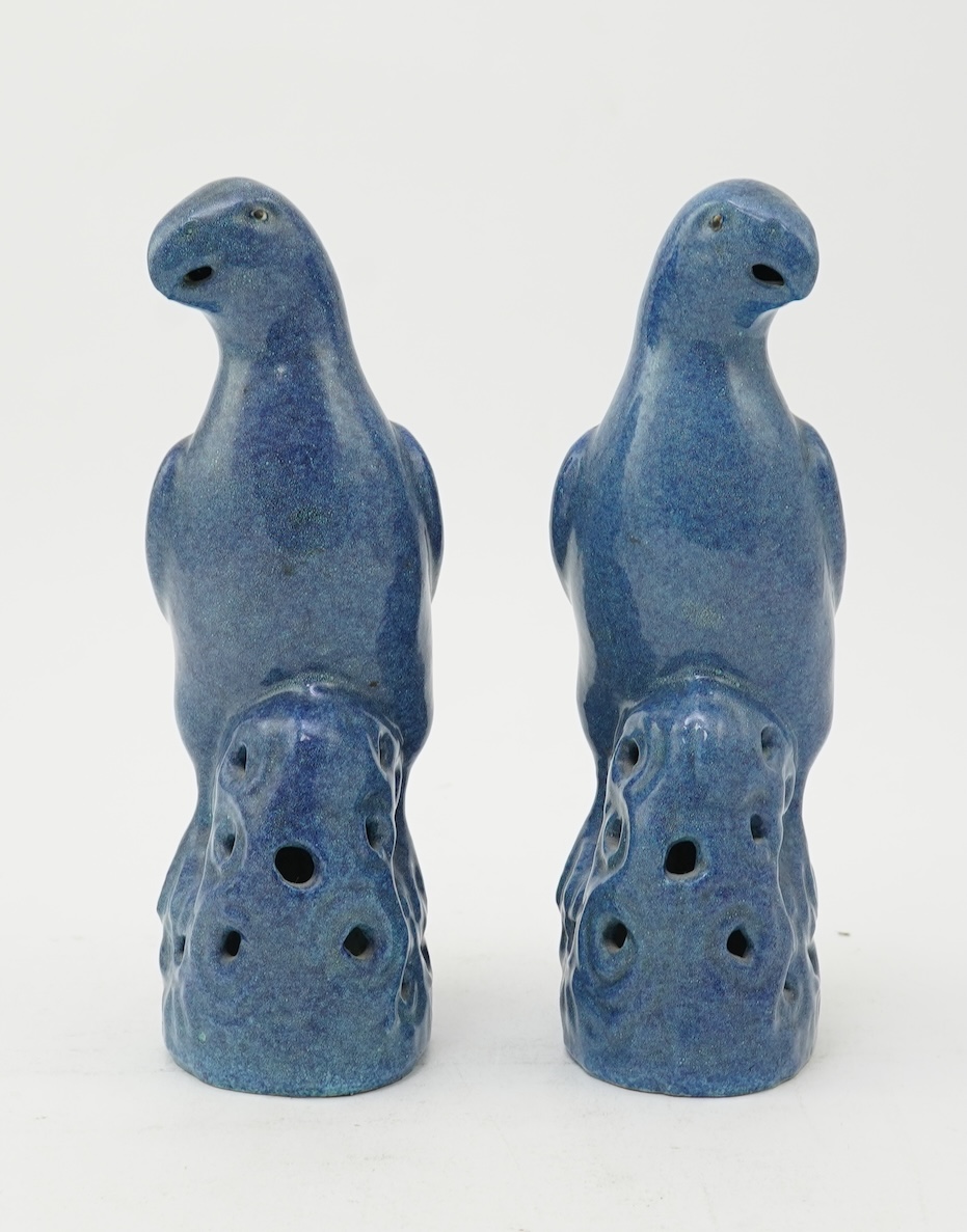 A pair of Chinese blue mottle glazed models of parakeets, 19th century